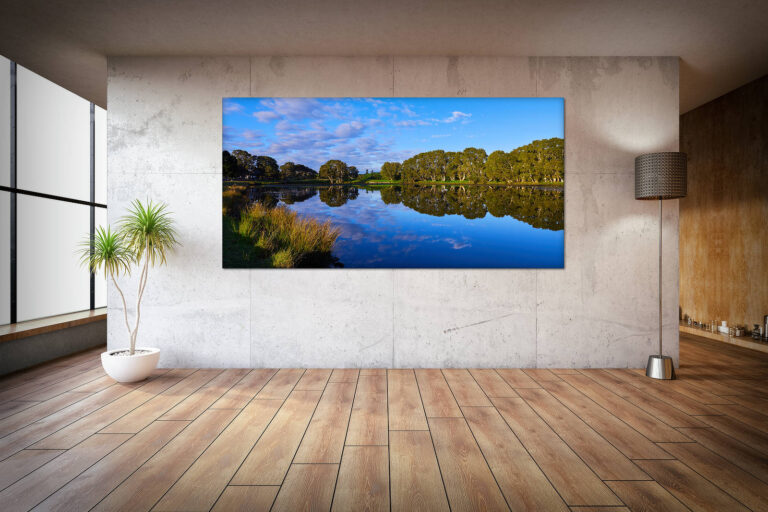 Conference room interior with white brick walls, a concrete floor, large windows and a long wooden table with wooden chairs near it. Side view. 3d rendering mock up