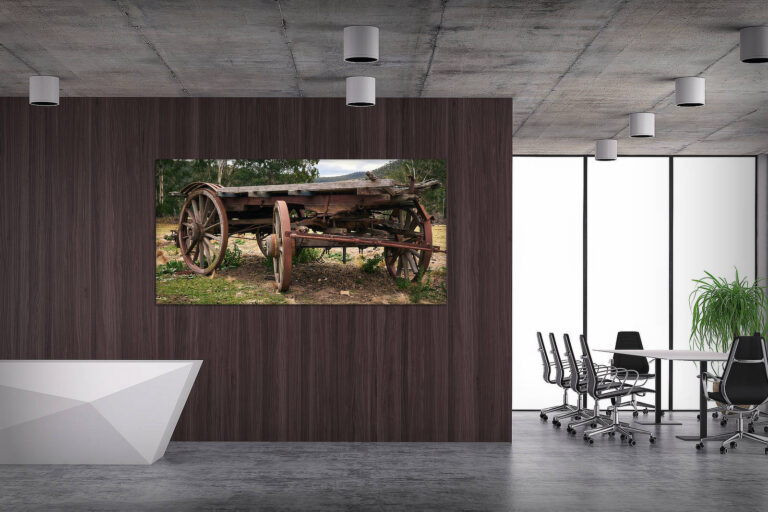 Modern office interior with conference table, black chairs and cashier counter. On concrete floor. Empty hardwood wall and windows in background. 3D rendered image.